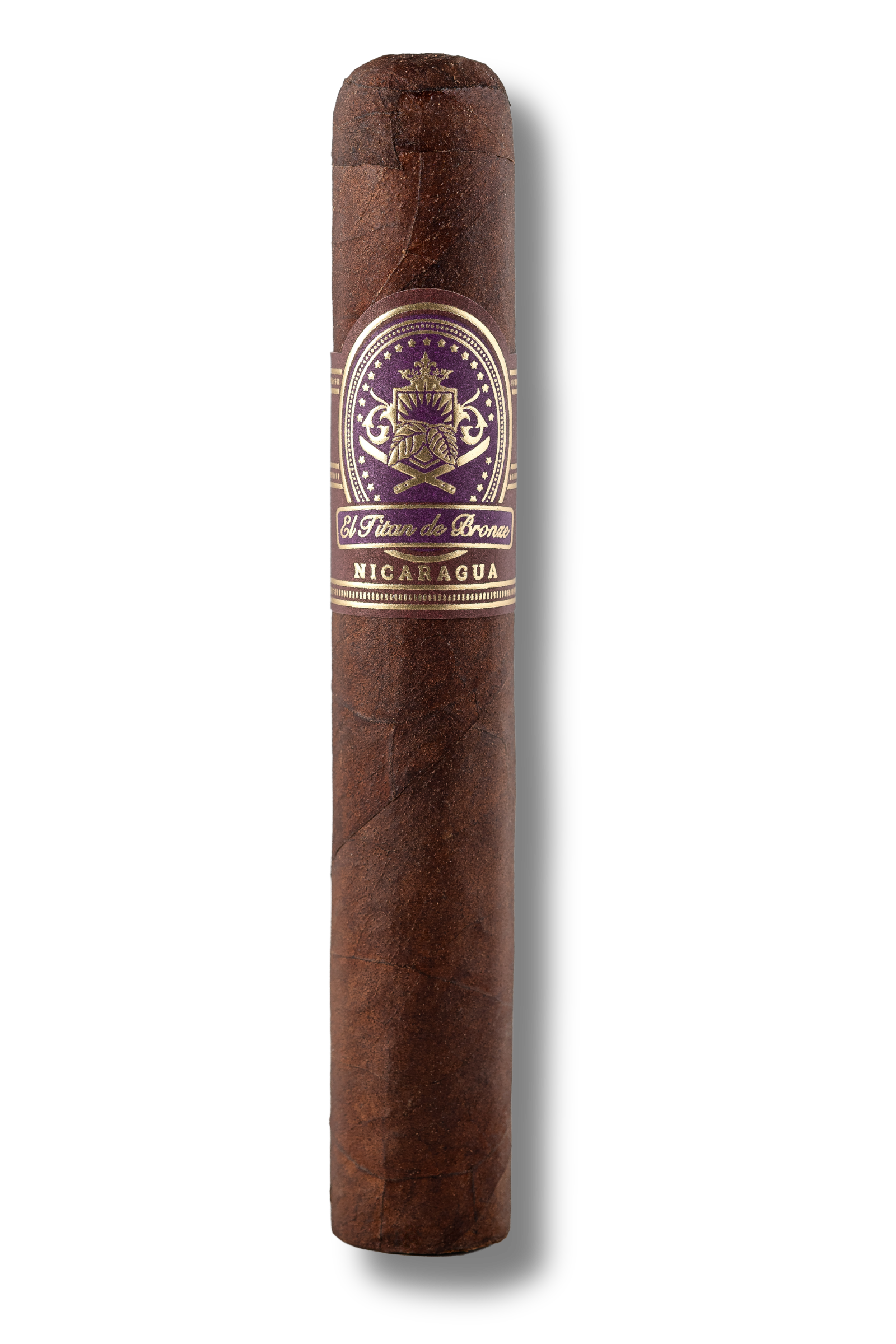 El Titan de Bronze Nicaragua Robusto cigar displaying a compact, full-flavored build with a dark Nicaraguan wrapper, precise triple cap, and artisanal hand-rolled detail